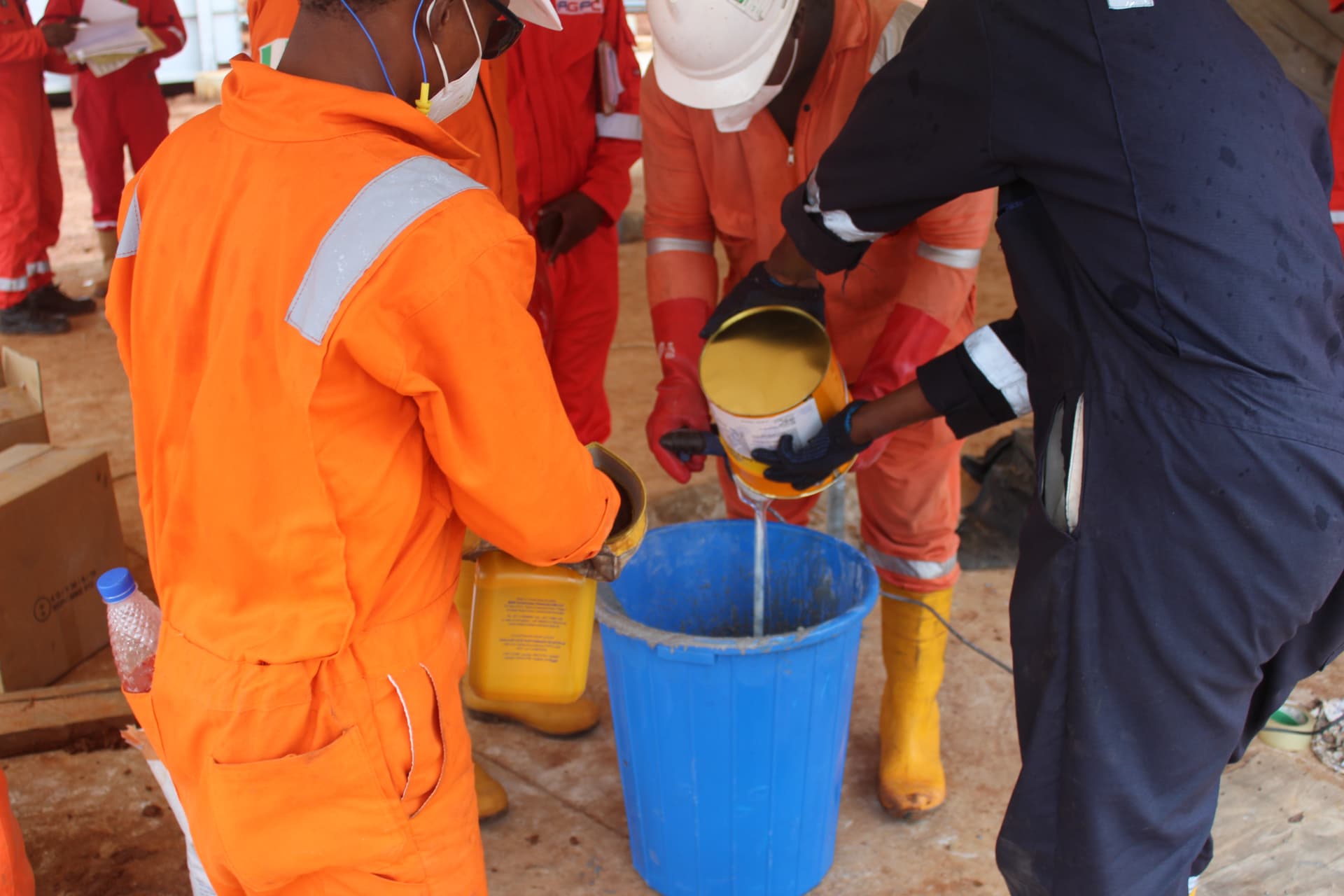 Measuring and adding admixture to the grout mix under supervision