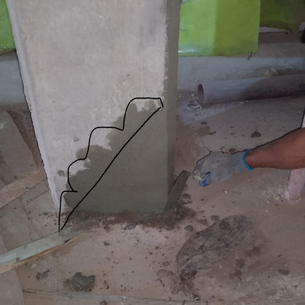 Rendering the base of a basement column after concrete repair