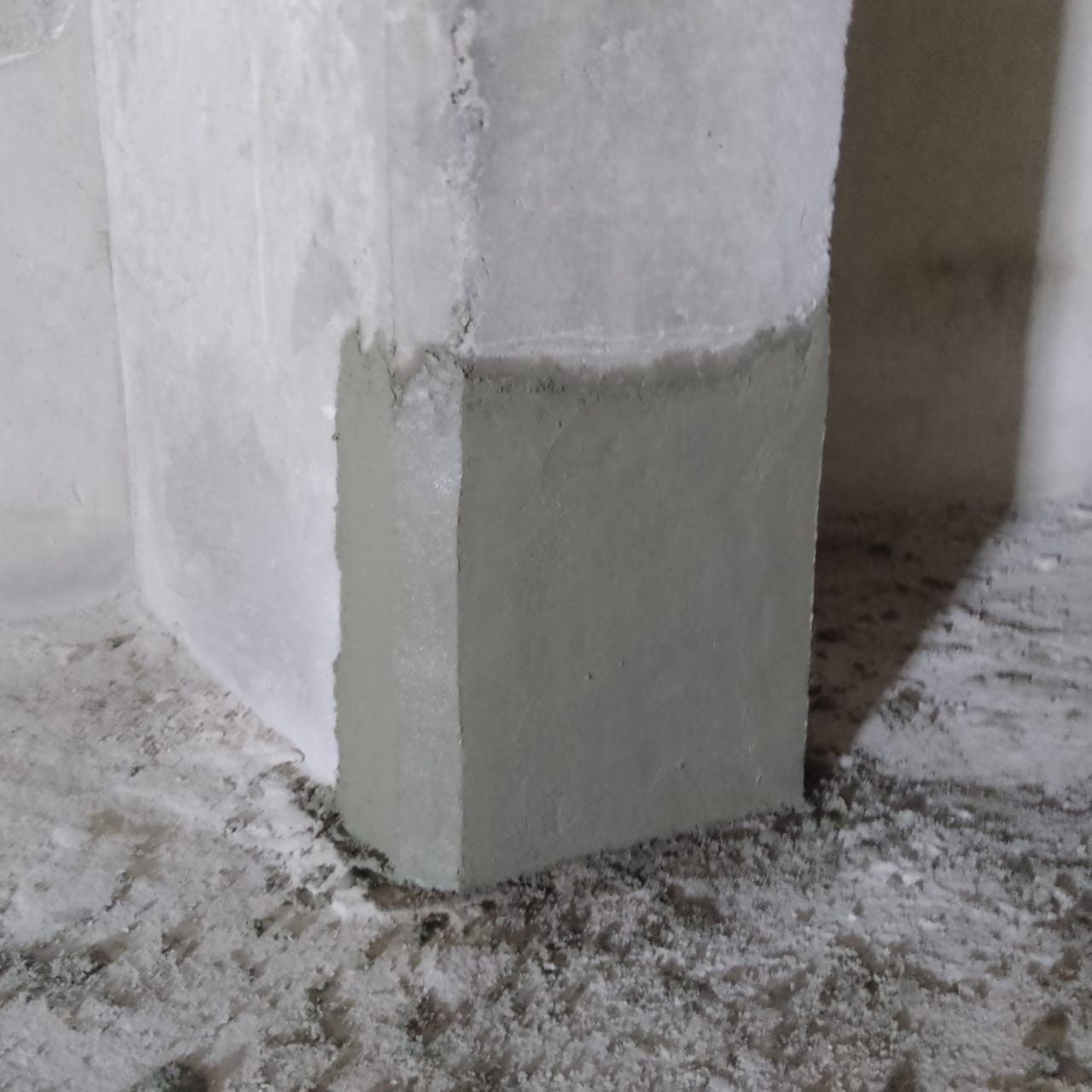 Column base rebuilt with repair mortar and finished square