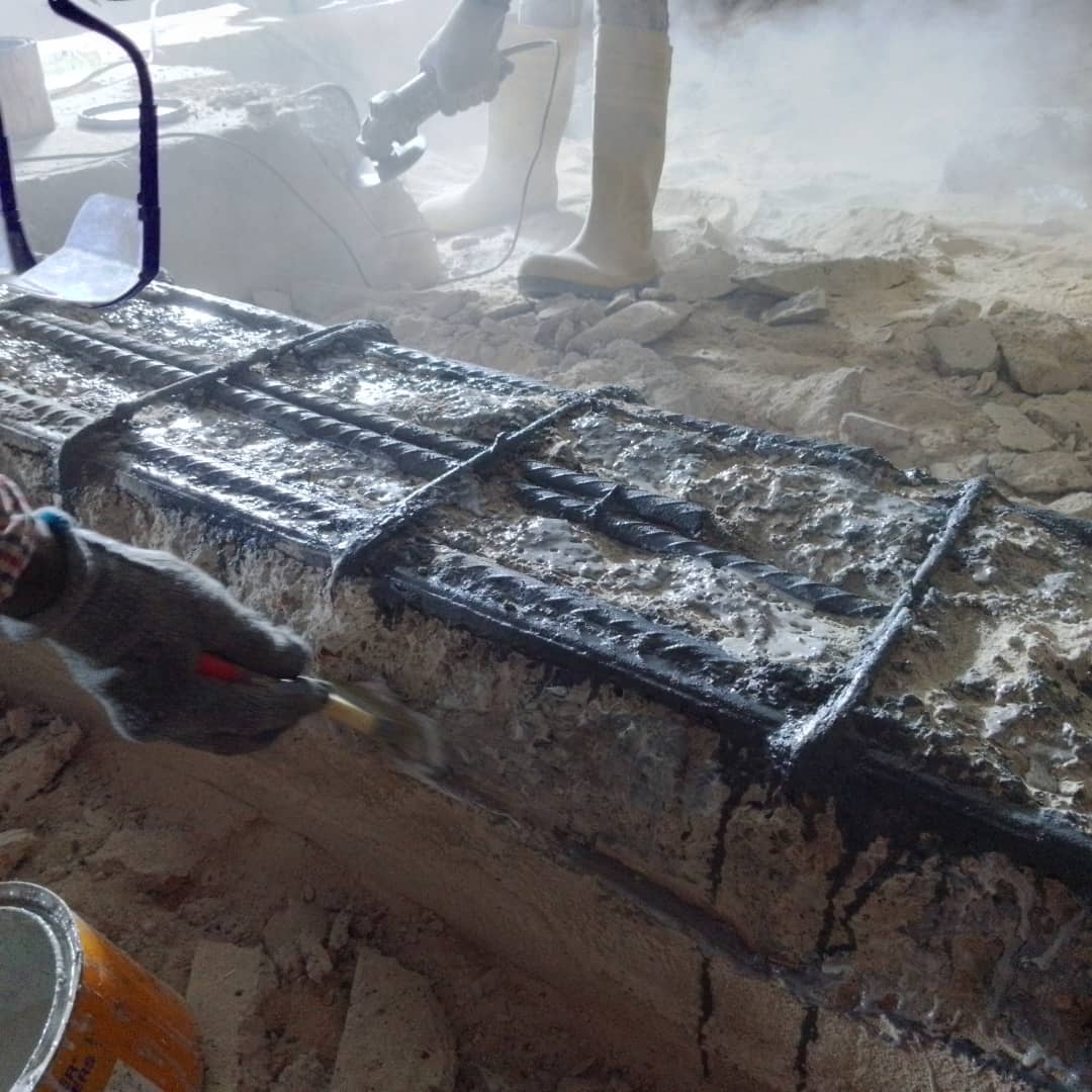 Corroded beam reinforcement coated with anti-corrosion primer