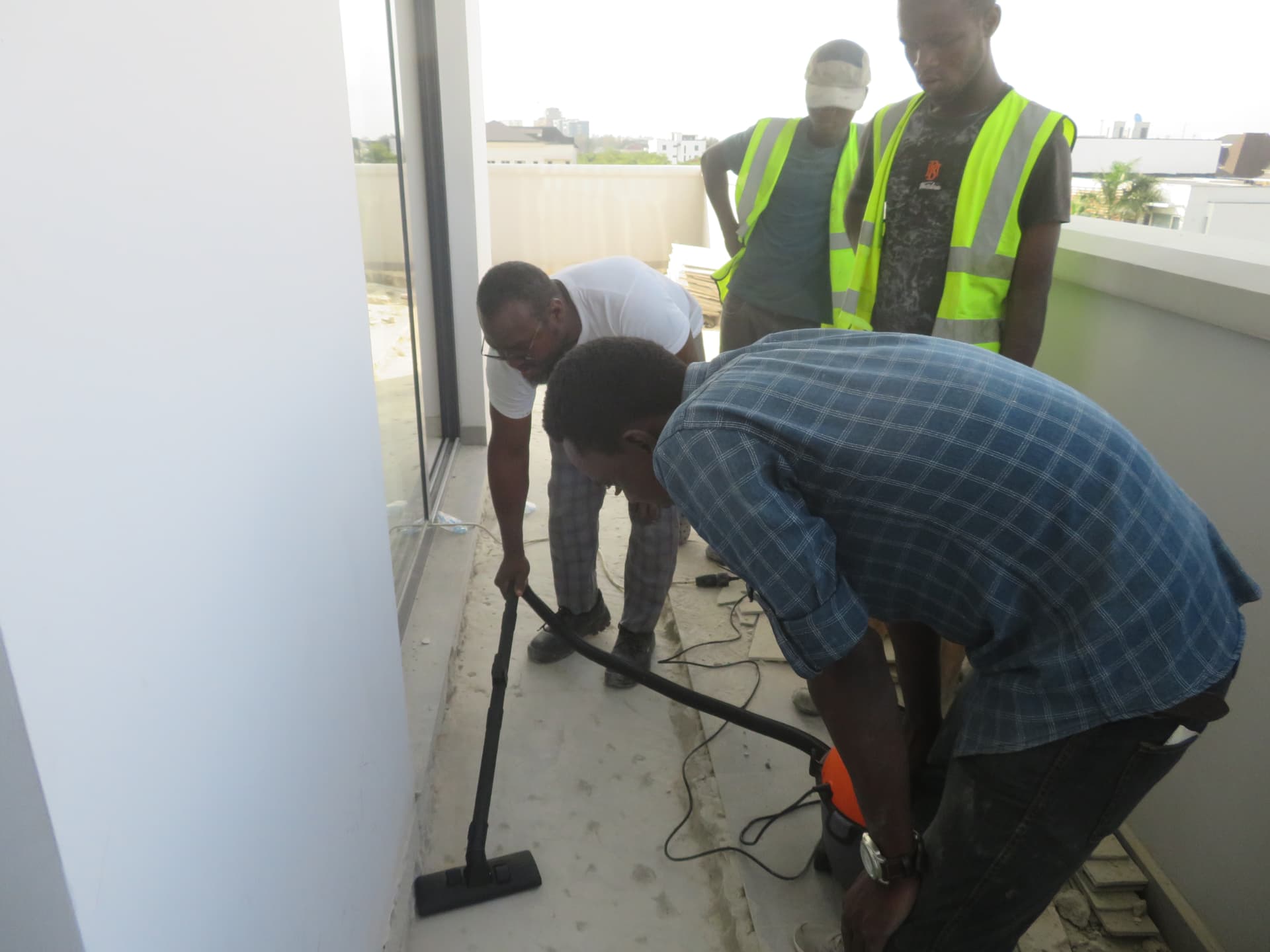 Vacuuming the prepared concrete groove ahead of laminate bonding
