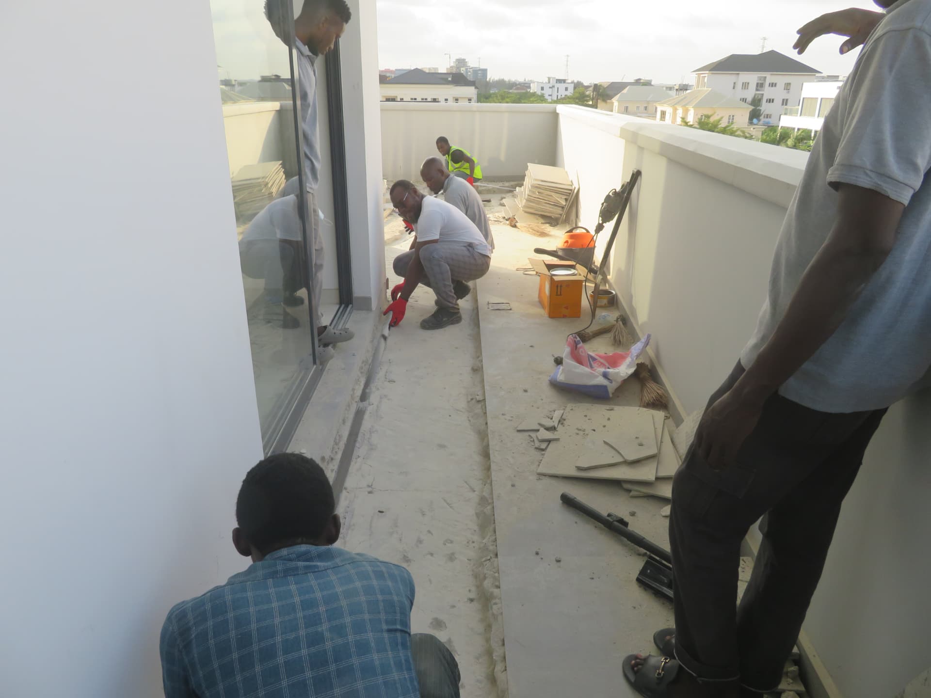 Concrete Dynamics team applying carbon fiber laminate on a project site