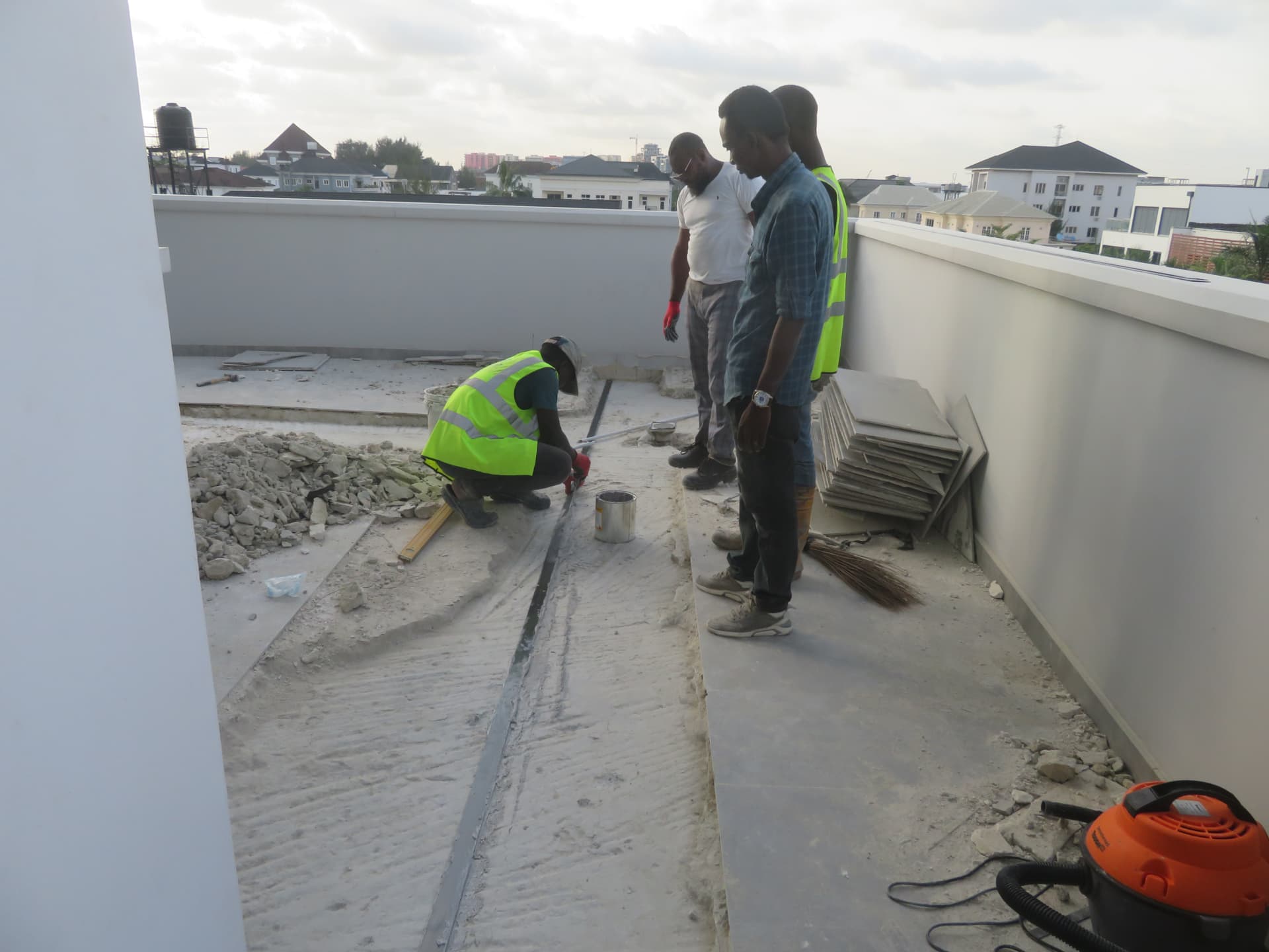 Technician bedding the carbon laminate into the prepared slab groove