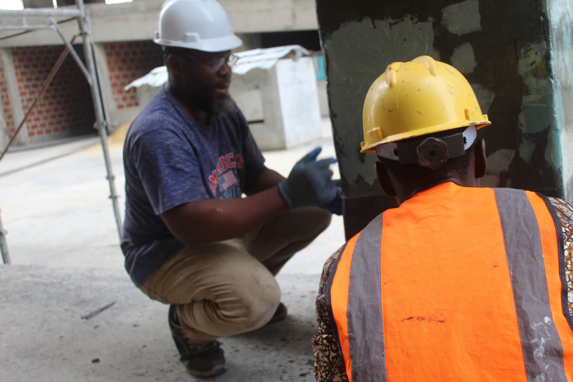Site engineer directing the carbon wrap installation on a column