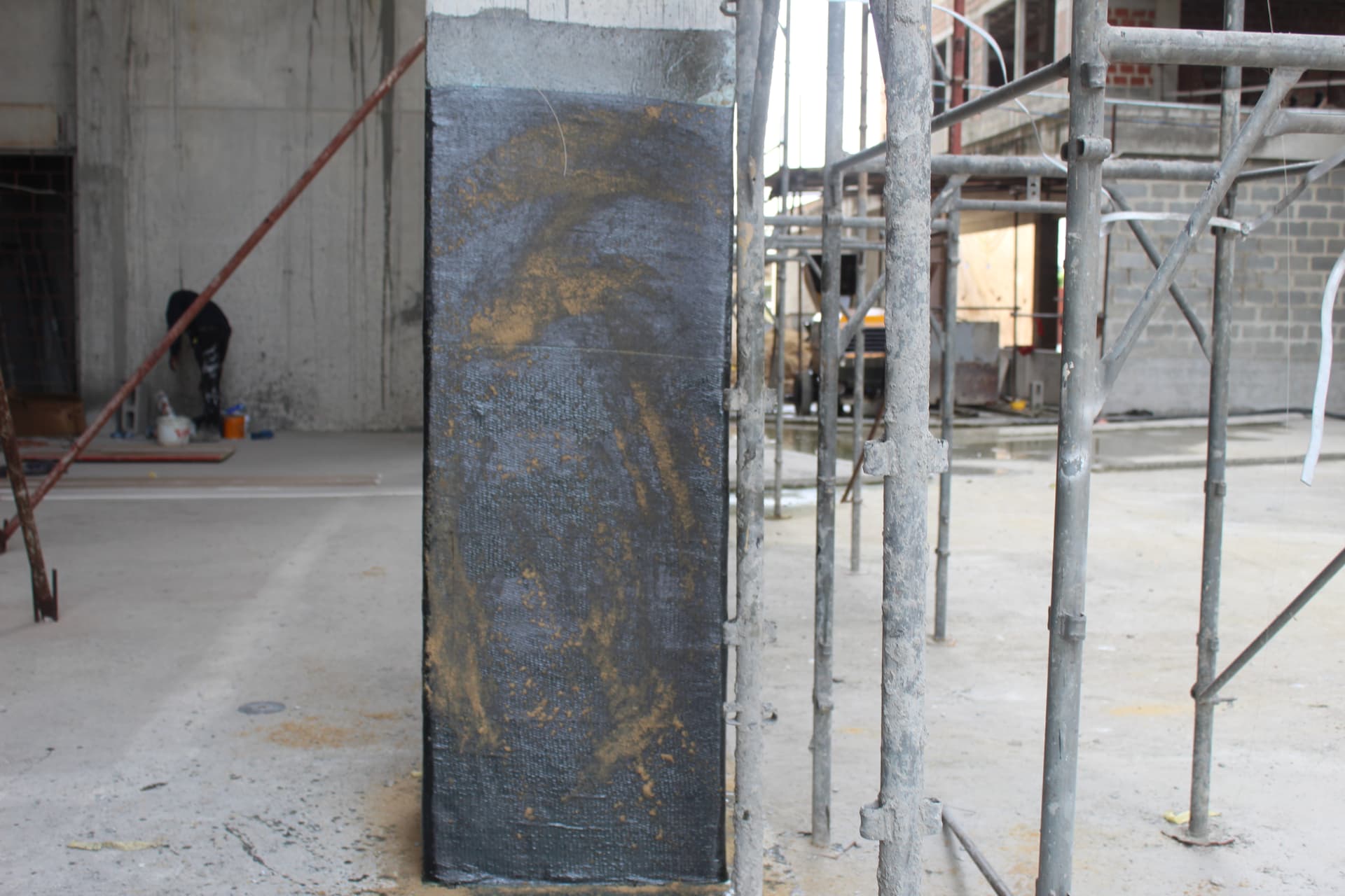 Carbon fibre wrapped column with second saturant coat curing
