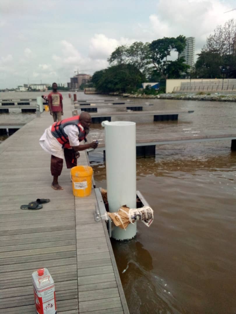 Coating works on jetty piles along the walkway