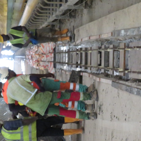 Crew working along the exposed reclaimer rail support frames