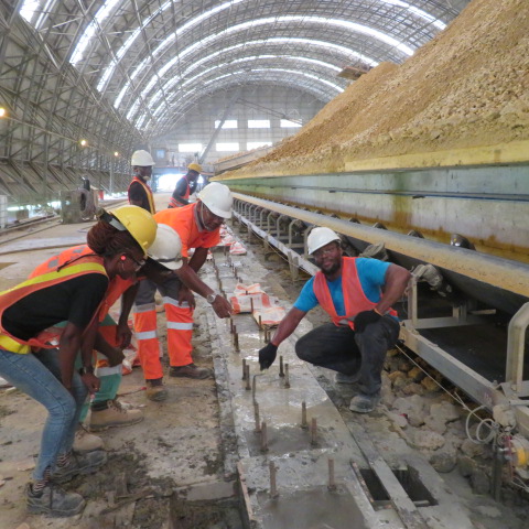 Team setting out anchor bolts and levelling the rail pedestal line