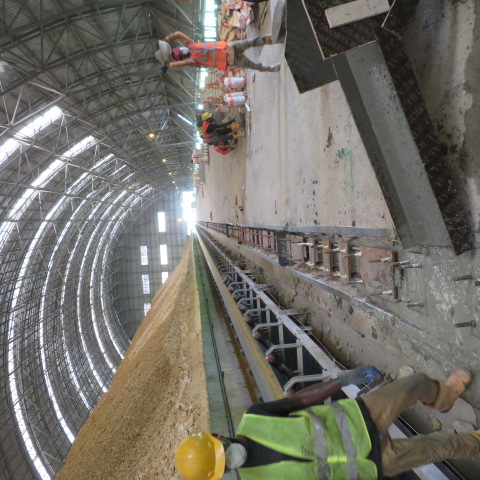 Operatives transporting materials along the reclaimer rail works