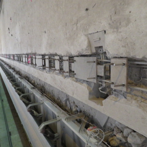 Rail base plates and anchorage set in fresh grout