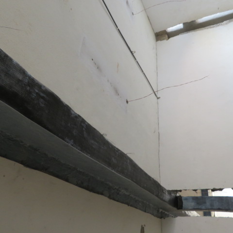 Completed carbon fibre wrapped beam running along the ceiling