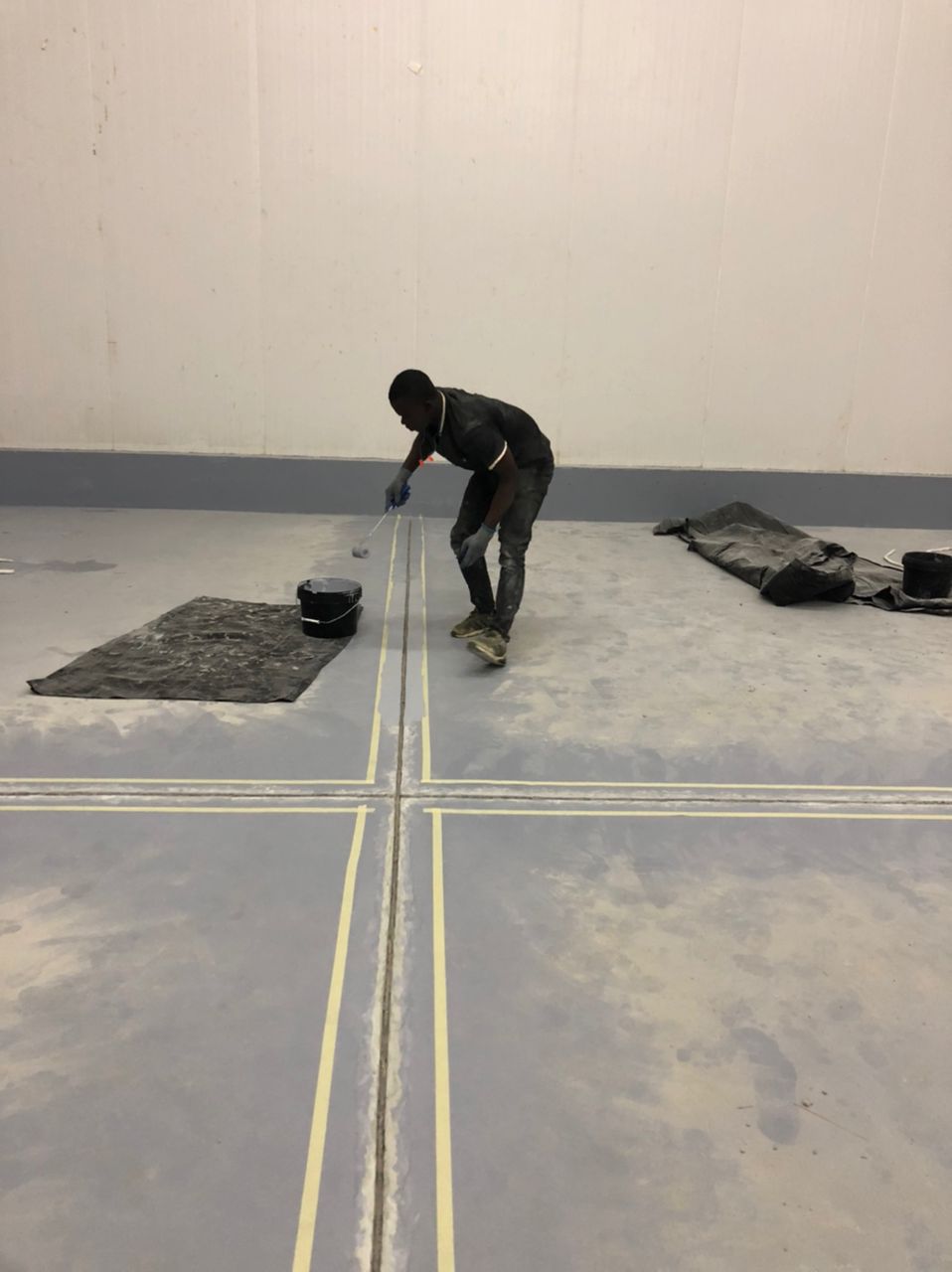 Joint coating applied between masking tape lines