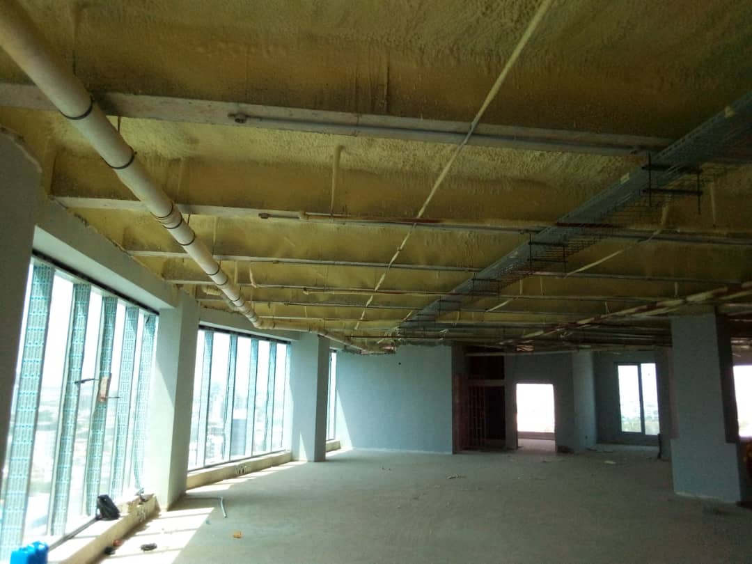 Insulated slab soffit and services along the glazed office floor