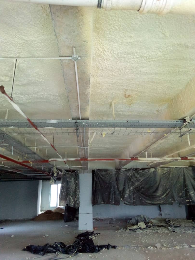 Continuous insulation applied to the underside of the concrete slab