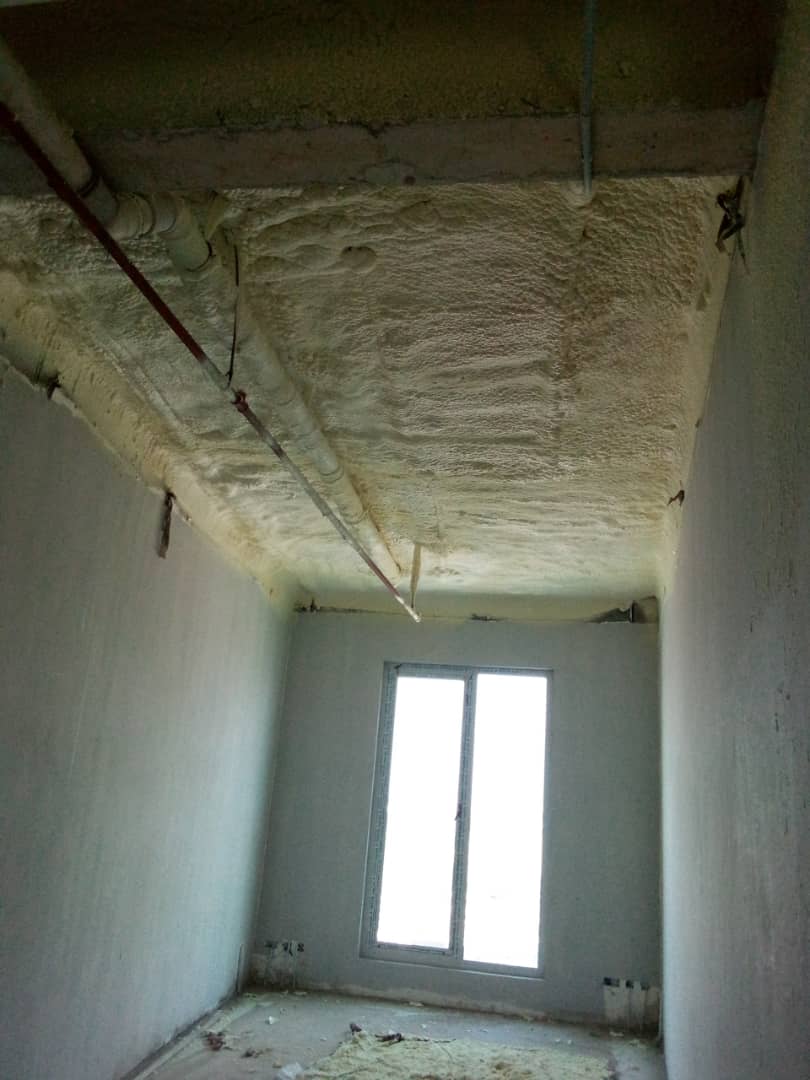 Insulated ceiling and beam within a smaller room at the tower