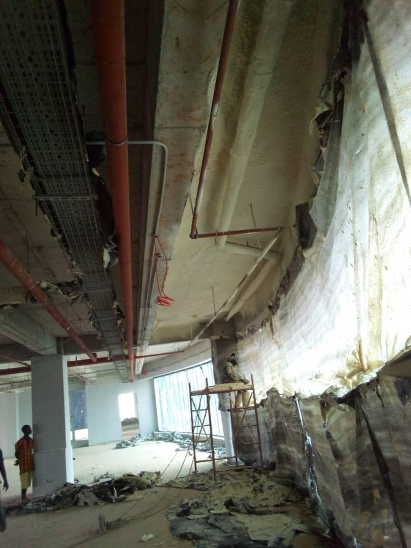 Protective sheeting in place while insulation works proceed overhead